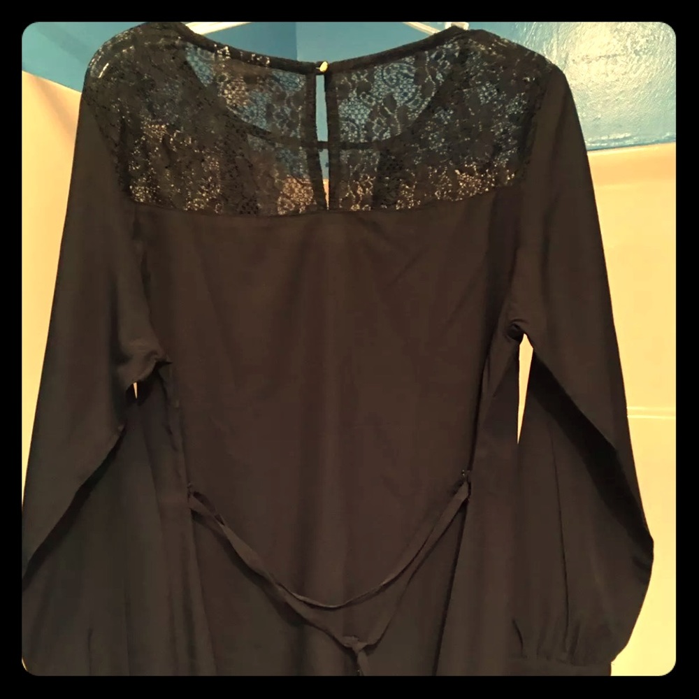 A black and white pair of maternity shirts